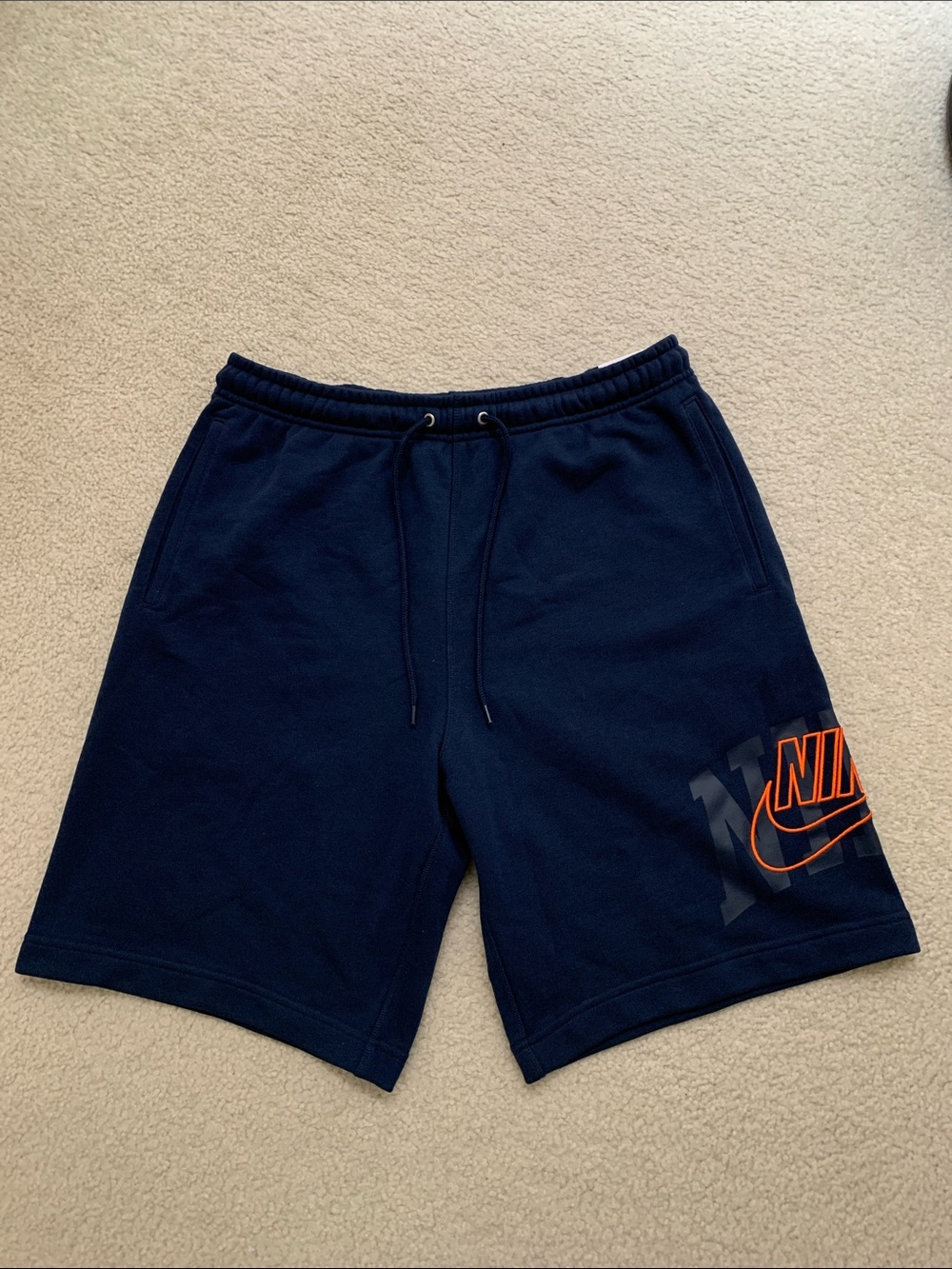 NEW Nike Men's Navy Blue Knee Length Athletic Shorts with Orange Logo